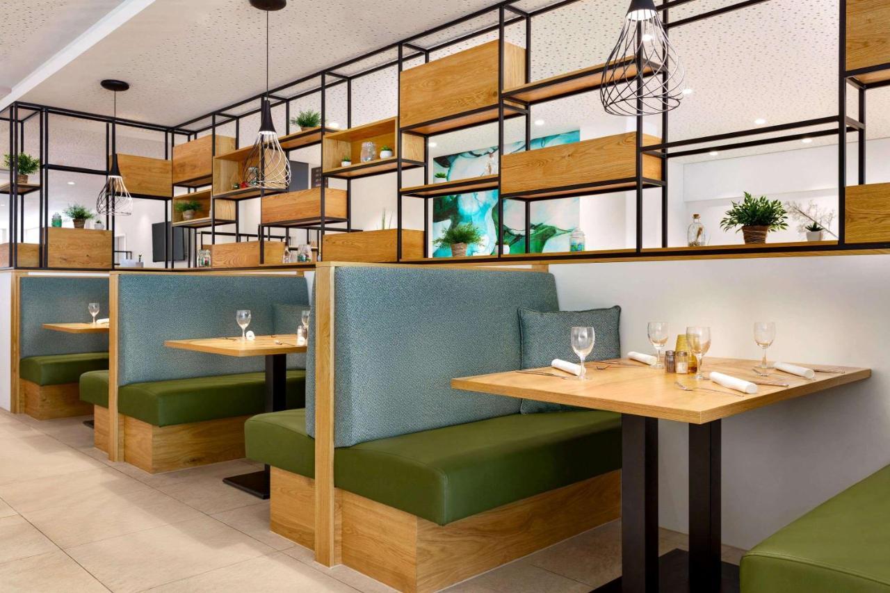 Hotel Wyndham Garden Munich Messe Esterno foto Restaurant interior design