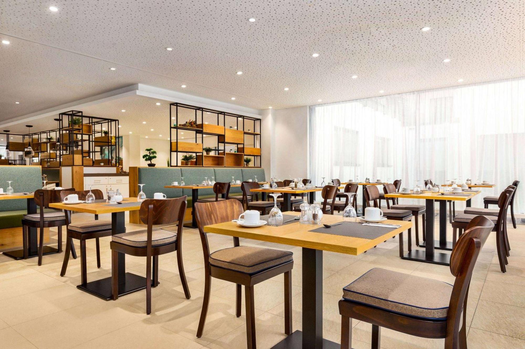 Hotel Wyndham Garden Munich Messe Esterno foto Restaurant