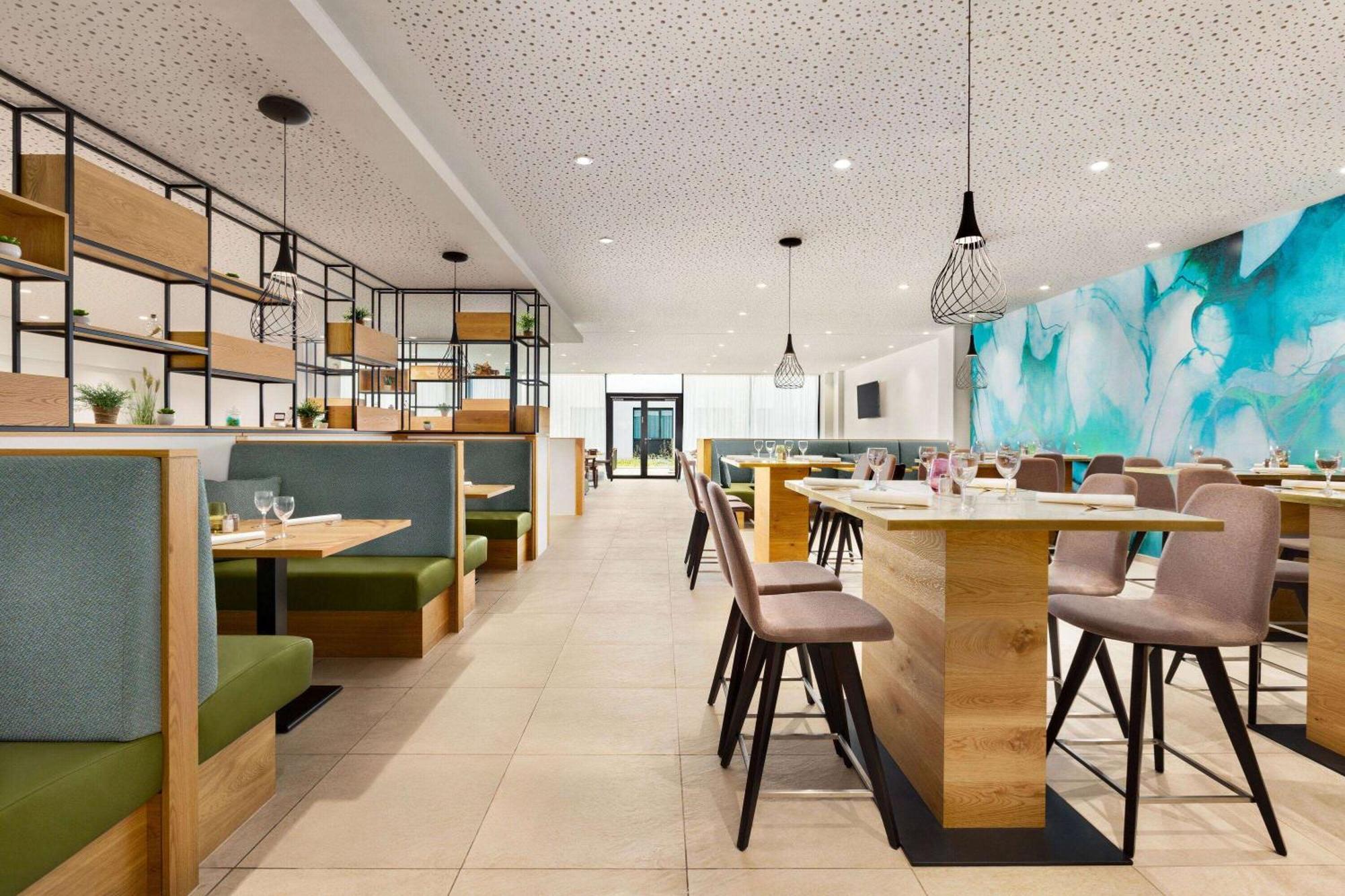 Hotel Wyndham Garden Munich Messe Esterno foto Interior of the restaurant